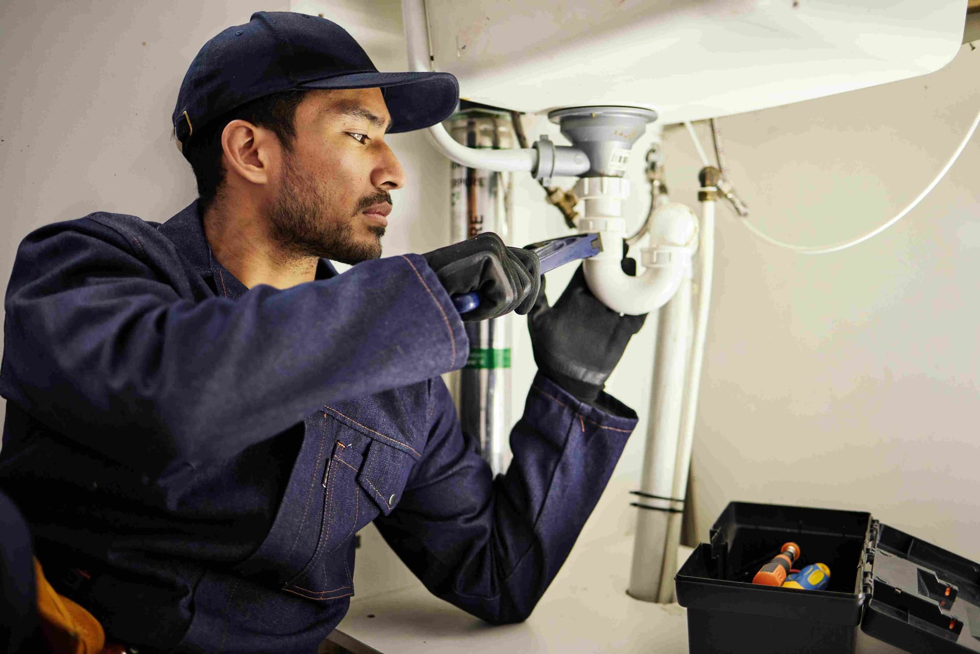 plumbing-pipes-and-maintenance-with-man-in-kitch